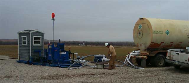 Tanker truck delivering CO2 to well