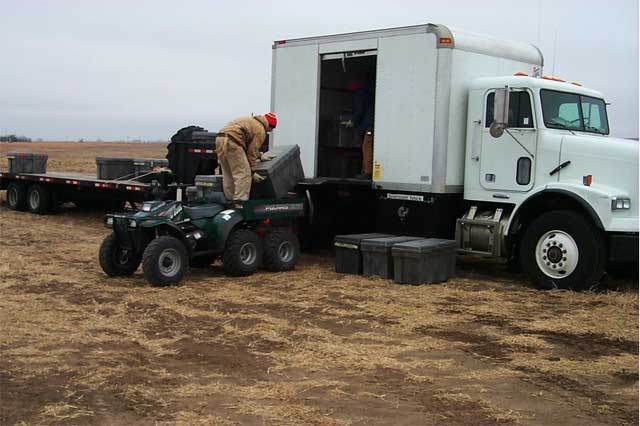 white panel truck for carrying small equipment packed in storage boxes